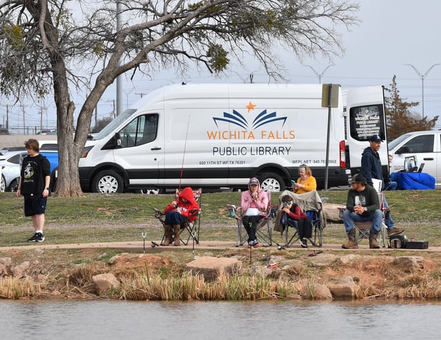 A Wichita Falls Public Library van was set up during the city of Wichita Falls Parks and Recreation Kids Fishing Rodeo at Plum Lake on Saturday, March 15, 2025.