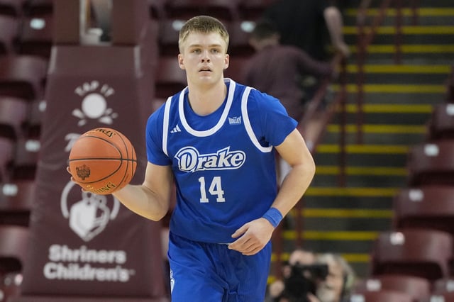 Bennett Stirtz #14 of the Drake Bulldogs dribbles up court during the Shriners Children&#39;s Charleston Classic college basketball game against the Florida Atlantic Owls at TD Arena on November 22, 2024 in Charleston, South Carolina.