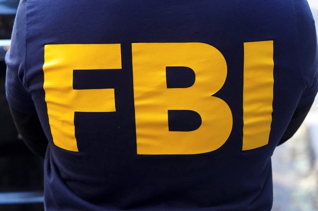 An FBI logo is pictured on an agent's shirt in the Manhattan borough of New York City, New York, U.S. October 19, 2021.
