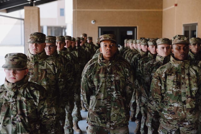Air Force recruits line up for a meal at Joint Base San Antonio-Lackland, the hub of Air Force basic training. Lackland is one of the scheduled stops for a Pentagon team that is investigating whether military installations are complying with Defense Secretary Pete Hegseth&#39;s orders to eliminate DEI.