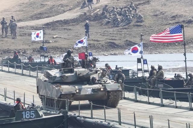A South Korean army K1E1 tank crosses a floating bridge on the Imjin River during a joint river-crossing exercise between South Korea and the United States as a part of the Freedom Shield military exercise in Yeoncheon, South Korea, Thursday, March 20, 2025. (AP Photo/Ahn Young-joon)
