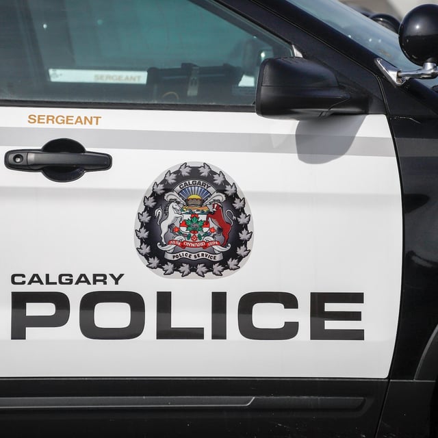 Police vehicles are seen at Calgary Police Service headquarters in Calgary on April 9, 2020. THE CANADIAN PRESS/Jeff McIntosh