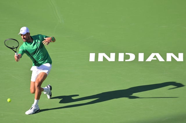Mar 8, 2025; Indian Wells, CA, USA;  Novak Djokovic (SRB) hits a shot against Botic Van De Zandschulp (not pictured) during the second round of the BNP Paribas Open at the Indian Well Tennis Garden. Mandatory Credit: Jayne Kamin-Oncea-Imagn Images/File Photo