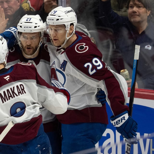 Colorado Avalanche centre Nathan MacKinnon (right) celebrates a goal against the Ottawa Senators with teammates left wing Jonathan Drouin and defenceman Cale Makar during first period NHL action, Thursday, March 20, 2025 in Ottawa.  THE CANADIAN PRESS/Adrian Wyld