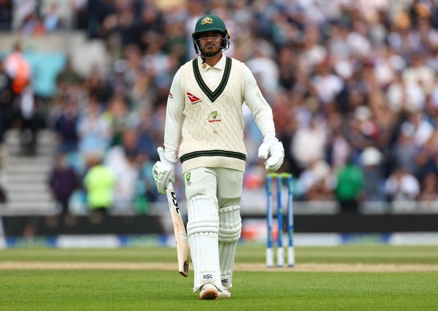 Cricket - Ashes - Fifth Test - England v Australia - The Oval, London, Britain - July 31, 2023 Australia's Usman Khawaja walks after losing his wicket, lbw bowled by England's Chris Woakes Action Images via Reuters/Andrew Boyers/File Photo