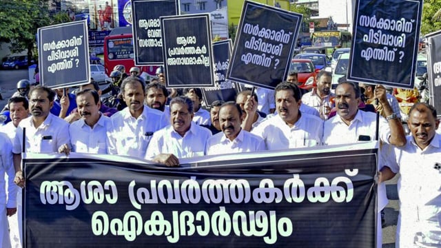 Leader of Opposition in Kerala Assembly VD Satheesan, centre, and other UDF MLAs take part in a protest march in support of ASHA workers protesting against the Kerala government since February 10, demanding post-retirement benefits and a hike in their honorarium, in Thiruvananthapuram, on Thursday. (PTI)