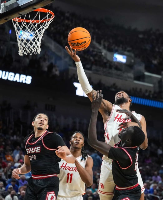 Houston forward J&#39;Wan Roberts (13) takes the ball to the basket against SIU Edwardsville during the second half of a college basketball game in the first round of the men’s NCAA Tournament at INTRUST Bank Arena in Wichita, Kan., Thursday, March 20, 2025.
