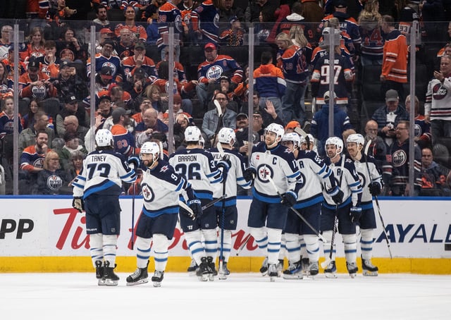 Winnipeg Jets players celebrate the win over the Edmonton Oilers during overtime NHL action in Edmonton on Thursday, March 20, 2025. THE CANADIAN PRESS/Jason Franson