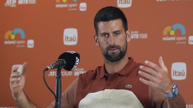 Novak Djokovic, of Serbia, speaks at a news conference.