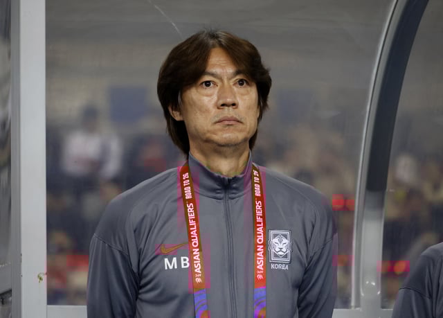 Soccer Football - World Cup - Asian Qualifiers - Third Round - Group B - South Korea v Iraq - Yongin Mireu Stadium, Yongin, South Korea - October 15, 2024 South Korea coach Myung-Bo Hong lines up during the national anthems before the match REUTERS/Kim Soo-Hyeon/File Photo