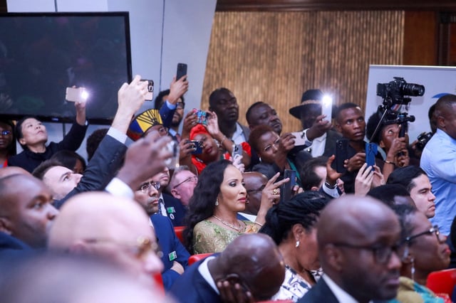 Guests and members of the media take pictures during the inauguration of Namibia's first female President, Netumbo Nandi-Ndaitwah at the State House in Windhoek, Namibia, March 21, 2025. REUTERS/Stringer