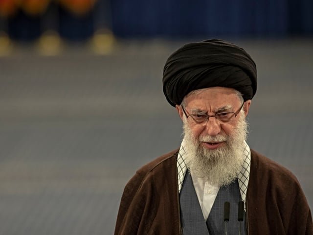 TEHRAN, IRAN - MARCH 01: Iran's supreme leader Ayatollah Ali Khamenei (R) speaks after casting his ballots during the parliamentary and key clerical body elections at a polling station on March 1, 2024 in Tehran, Iran. Iranians are voting in parliamentary elections and will also cast ballots for the Assembly of Experts, which selects and nominally oversees the work of Iran's supreme leader. (Photo by Majid Saeedi/Getty Images)