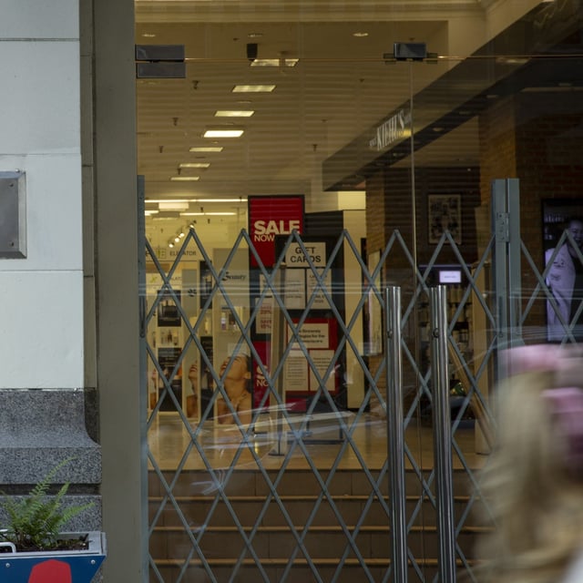 People outside the Hudson’s Bay store on Granville and Georgia in Vancouver, B.C. on March 20, 2025. The future of the Hudson’s Bay Company (HBC) is up in the air as an Ontario judge decides whether the company will have to undergo full liquidation. A final decision will be announced on Friday, March 21, 2025. [Isabella Falsetti/Globe and Mail]
