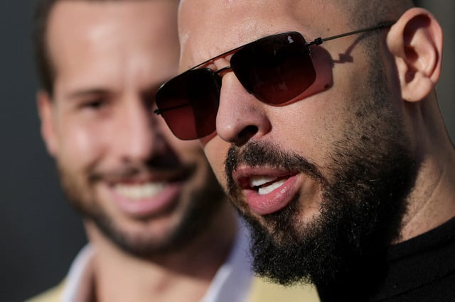 Andrew Tate, next to his brother Tristan Tate, talks to media representatives after exiting the Bucharest courthouse, in Bucharest, Romania, January 9, 2025. Inquam Photos/Octav Ganea via REUTERS/File Photo