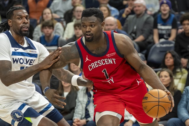 Mar 19, 2025; Minneapolis, Minnesota, USA; New Orleans Pelicans forward Zion Williamson (1) drives to the basket past Minnesota Timberwolves center Naz Reid (11) in the second half at Target Center. Mandatory Credit: Jesse Johnson-Imagn Images/File Photo