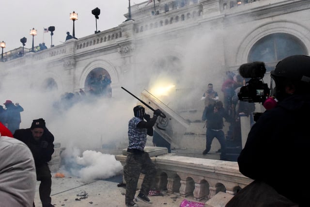 Police clear the U.S. Capitol Building with tear gas as supporters of U.S. President Donald Trump gather outside, in Washington, U.S. January 6, 2021.