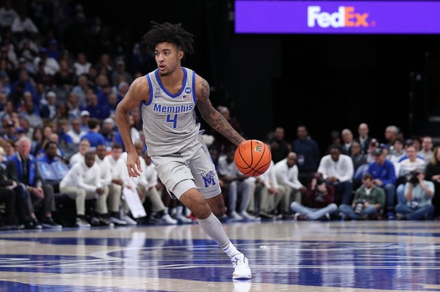 PJ Haggerty #4 of the Memphis Tigers handles the ball during the game against the Mississippi State Bulldogs at FedExForum on December 21, 2024 in Memphis, Tennessee.
