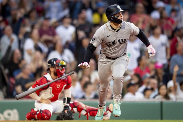 BOSTON, MA - JUNE 14: Alex Verdugo #24 of the New York Yankees hits a two-run home run during the first inning of a game against the Boston Red Sox on June 14, 2024 at Fenway Park in Boston, Massachusetts.
