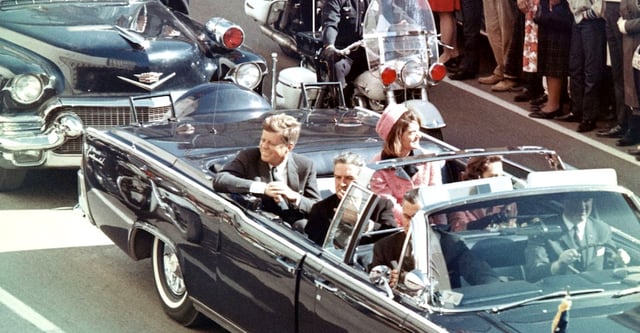 Picture of President Kennedy in the limousine in Dallas, Texas, on Main Street, minutes before the assassination. Also in the presidential limousine are Jackie Kennedy, Texas Governor John Connally, and his wife, Nellie.