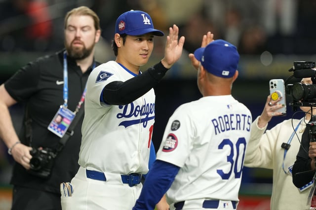 Mar 19, 2025; Bunkyo, Tokyo, JPN; Los Angeles Dodgers designated hitter Shohei Ohtani (17) (left) celebrates with Manager Dave Roberts (30) (right) after defeating the Chicago Cubs during the Tokyo Series at Tokyo Dome. Mandatory Credit: Darren Yamashita-Imagn Images/ File Photo