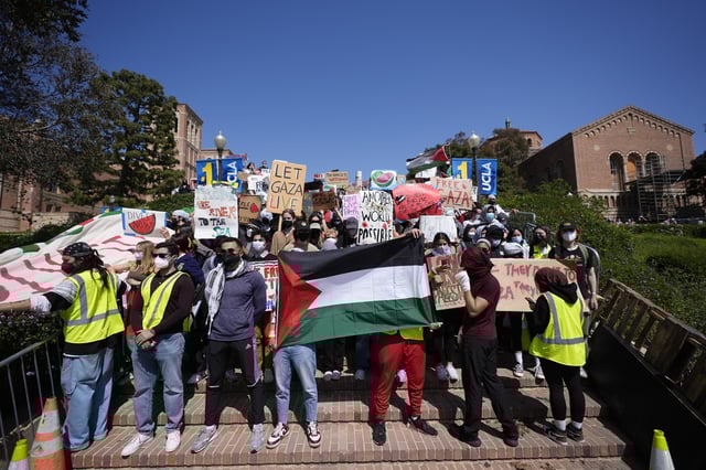 FILE - Demonstrators gather on the UCLA campus after nighttime clashes between pro-Israel and pro-Palestinian groups, May 1, 2024, in Los Angeles. (AP Photo/Jae C. Hong, File)