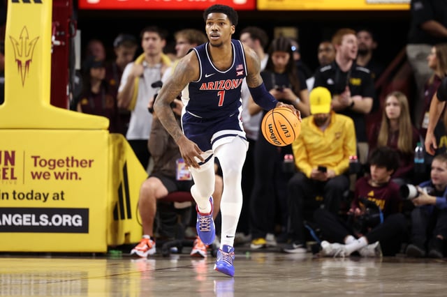 Caleb Love #1 of the Arizona Wildcats controls the ball during the game against the Arizona State Sun Devils at Desert Financial Arena on February 01, 2025 in Tempe, Arizona. The Wildcats defeated the Sun Devils 81-72.