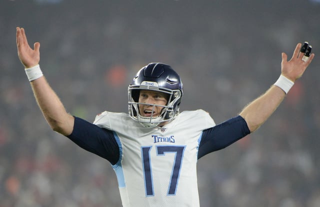 Ryan Tannehill #17 of the Tennessee Titans celebrates as they take on the New England Patriots in the second quarter of the AFC Wild Card Playoff game at Gillette Stadium on January 4 in Foxborough, Massachusetts.