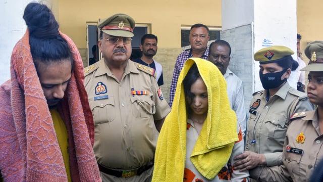 Police take away Merchant Navy officer Saurabh Rajput's wife Muskan and her lover Sahil Shukla after they were arrested in connection with his murder.