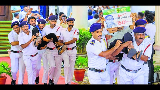 BJP MLAs being evicted by Marshals during the Budget session of Karnataka Assembly, in Bengaluru, Friday, March 21, 2025. Eighteen BJP MLAs were suspended for six months from the Legislative Assembly on Friday for disrespecting Speaker U T Khader. (PTI)