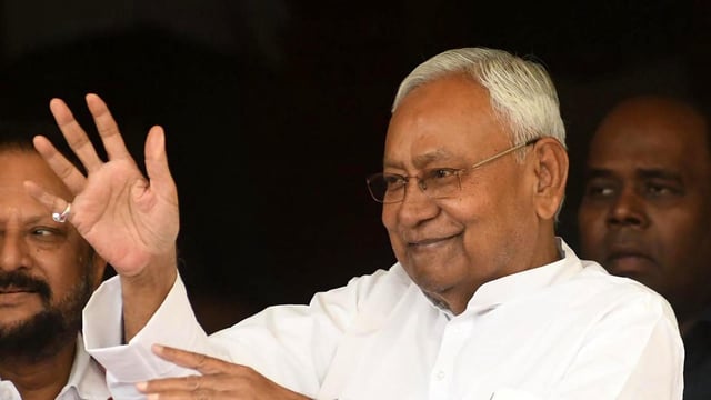 Bihar CM Nitish Kumar was criticised by the RJD for talking and gesturing while the national anthem played during an event.