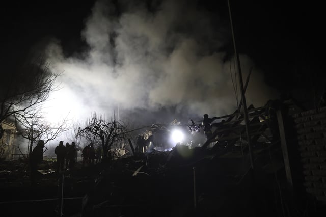 Rescuers work on site of a residential building destroyed by a Russian drone strike in Zaporizhzhia, Ukraine, Friday, March 21, 2024. (AP Photo/Kateryna Klochko)