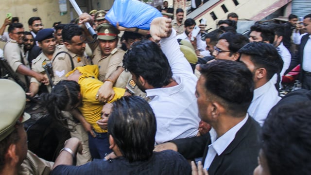 Police intervene as lawyers trash accused Sahil Shukla while he was being produced in a court in connection with Merchant Navy officer Saurabh Rajput's killing, in Meerut, Wednesday, March 19, 2025. Muskan with Sahil allegedly killed her husband Saurabh, dismembered his body, and sealed the body parts in a drum filled with cement. 