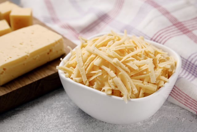 Stock image/file photo: Shredded cheese in a bowl.