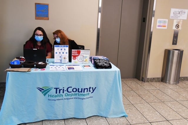 Elicia Chacon, left, and Kate Slifer, staffs of Tri-County Health Department, check schedule of Hepatitis &amp; HIV Testing at the office in Aurora, Colorado on Thursday, Sept. 8, 2021.