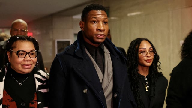 Actor Jonathan Majors with Meagan Good for the jury selection in his assault and harassment case at Manhattan Criminal Court in New York City on December 18, 2023. 