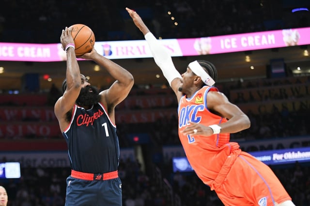 The Clippers’ James Harden, left, tries to shoots over Oklahoma City’s Shai Gilgeous-Alexander during the second half Nov. 11, 2024, in Oklahoma City. (AP Photo/Kyle Phillips)