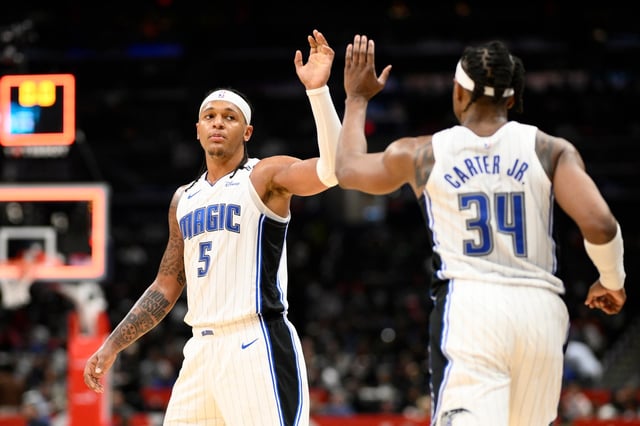 Orlando Magic forward Paolo Banchero (5) and center Wendell Carter Jr. (34) react at the end of the third quarter on Friday night in Washington.  (AP Photo/Nick Wass)