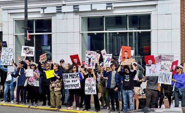 People protest against Elon Musk outside a Tesla dealership in the neighbourhood of Georgetown, in Washington, D.C., U.S., March 22, 2025. REUTERS/Yann Tessier