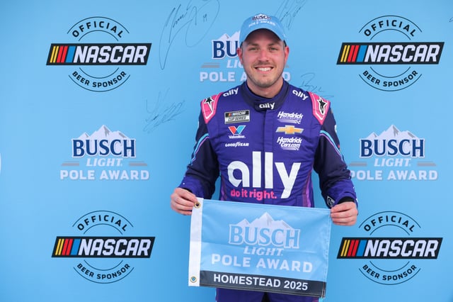 Mar 22, 2025; Homestead, Florida, USA; NASCAR Cup Series driver Alex Bowman (48) celebrates with Busch Light Pole Award after winning the pole for the the Straight Talk Wireless 400 at Homestead-Miami Speedway. Sam Navarro-Imagn Images