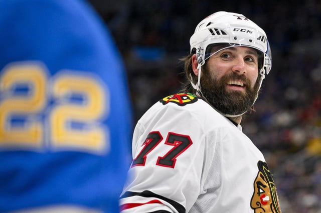 Mar 22, 2025; St. Louis, Missouri, USA;  Chicago Blackhawks left wing Patrick Maroon (77) looks on during the third period against the St. Louis Blues at Enterprise Center. Jeff Curry-Imagn Images