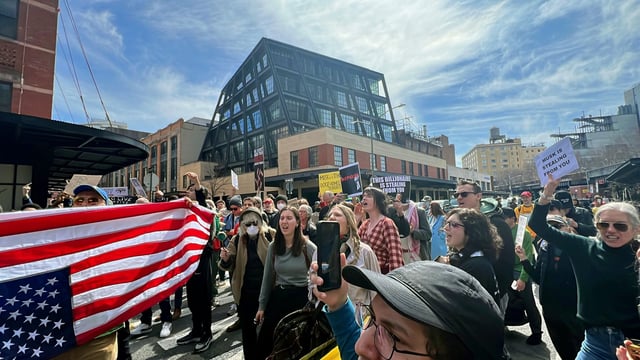 Protesters gather outside a Tesla showroom in New York on Saturday, March 22, 2025, to denounce Elon Musk and DOGE.