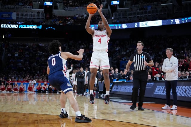 Houston Cougars guard L.J. Cryer (4) shoots the ball against Gonzaga Bulldogs guard Ryan Nembhard (0) during the first half at Intrust Bank Arena.