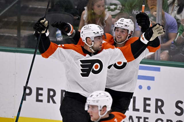 Mar 22, 2025; Dallas, Texas, USA; Philadelphia Flyers center Ryan Poehling (25) and right wing Travis Konecny (11) celebrates after Poehling scores a goal against the Dallas Stars during the second period at the American Airlines Center. Mandatory Credit: Jerome Miron-Imagn Images
