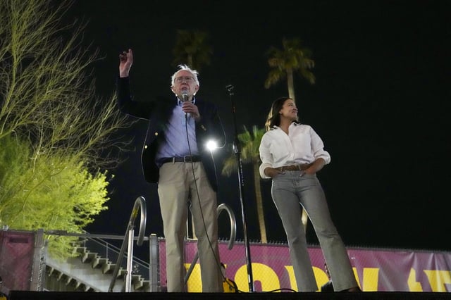 Sen. Bernie Sanders, I-Vt., and Rep. Alexandria Ocasio-Cortez, D-N.Y., speak outside of Arizona State University to the overflow crowd that did not get inside the arena, during a "Fighting Oligarchy" tour event Thursday, March 20, 2025, in Tempe, Ariz. (AP Photo/Ross D. Franklin)