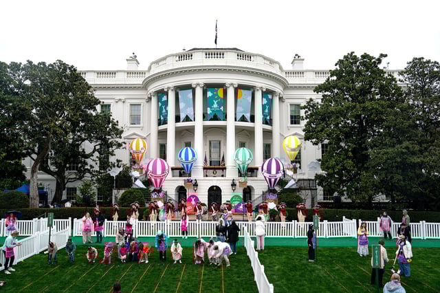 Guests participate in the annual White House Easter Egg Roll on the South Lawn of the White House.