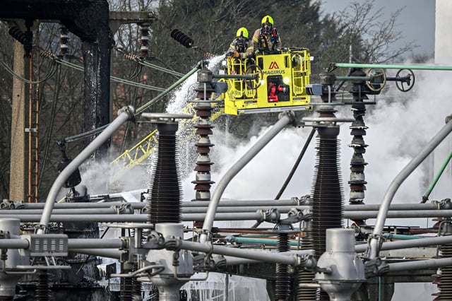 Members of the Fire Brigade attend the scene following a major fire at an electrical substation at Heathrow on March 21, 2025 in London.