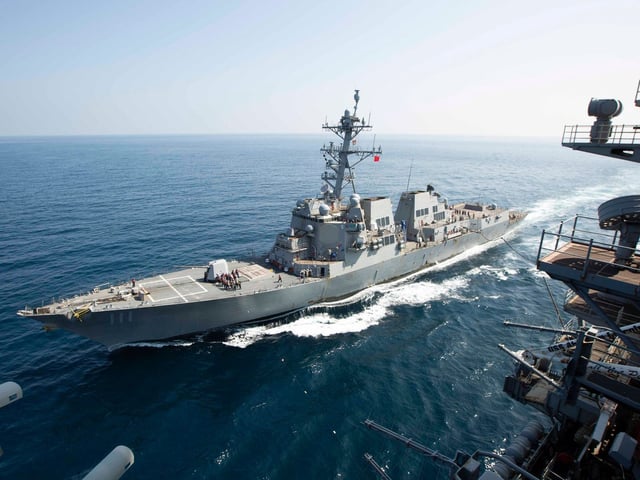 The destroyer USS Spruance, seen from the Nimitz-class aircraft carrier USS Abraham Lincoln, in the Middle East region in November 2024.
