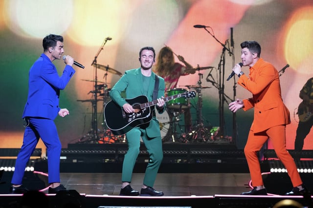 Joe Jonas, from left, Kevin Jonas and Nick Jonas of the Jonas Brothers perform during their &#34;Happiness Begins&#34; tour stop at the former AT&amp;T Center on Sept. 27, 2019. The group on Sunday announced a San Antonio stop as part of its upcoming Jonas20: Living the Dream Tour.