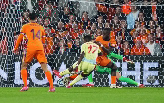 Nico Williams of Spain scores his team&#39;s first goal during the UEFA Nations League quarterfinal leg one match between Netherlands and Spain at De Kuip on March 20, 2025 in Rotterdam, Netherlands.