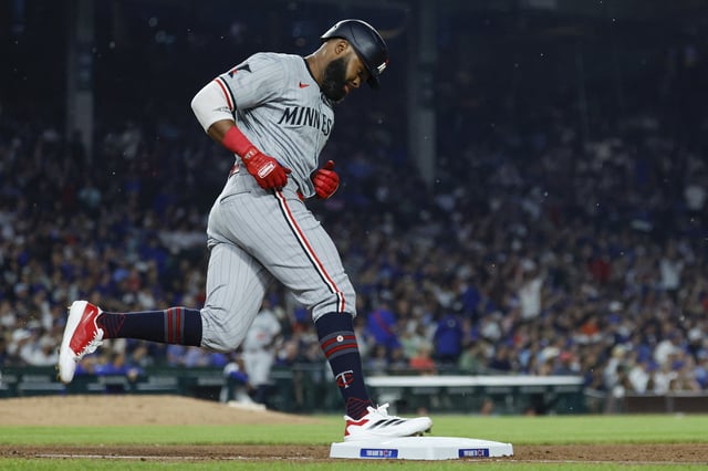 Aug 5, 2024; Chicago, Illinois, USA; Minnesota Twins outfielder Manuel Margot (13) rounds the bases after hitting a solo home run against the Chicago Cubs during the fifth inning at Wrigley Field. Kamil Krzaczynski-USA TODAY Sports